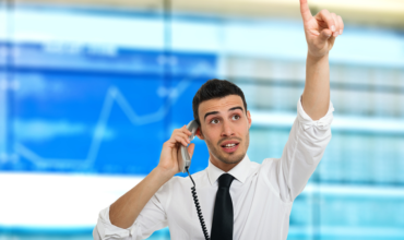stock broker on phone