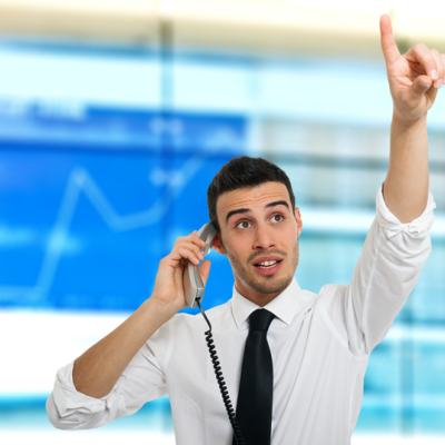 stock broker on phone