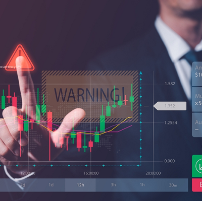 man touching screen of market trading candles