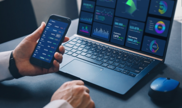 trading on laptop and phone