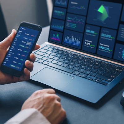trading on laptop and phone